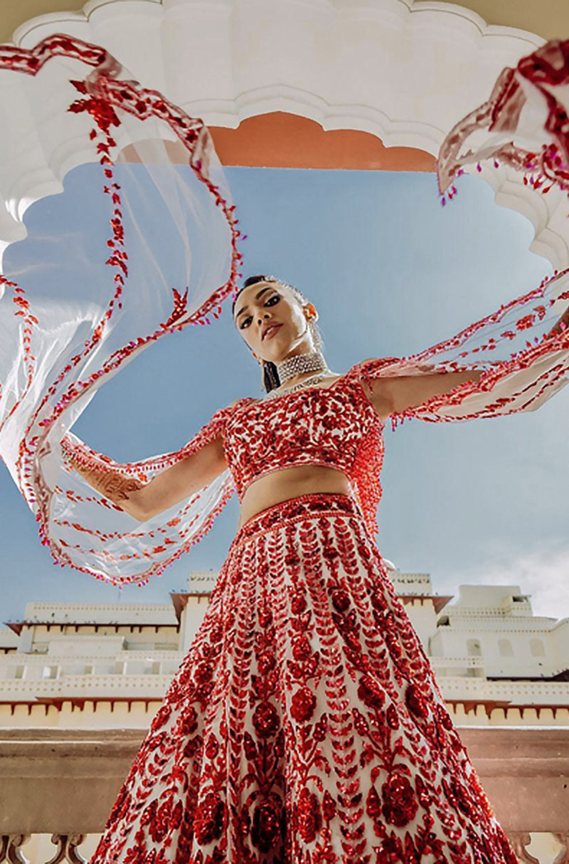 Bride: Raveena & Groom: Saket Mehta Co-ordinating each other in Red-Pink Threadwork Ensemble