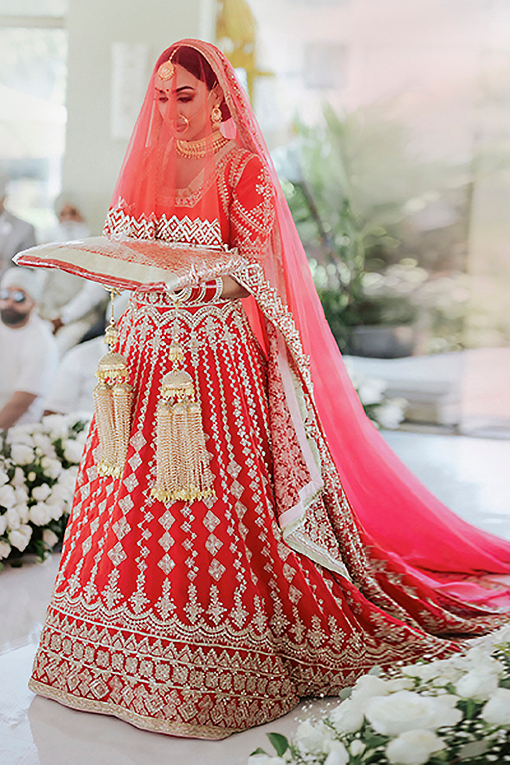 Bride: Sukhi Lidher Sidhu wearing our Red Nooraniyat Lehenga Set