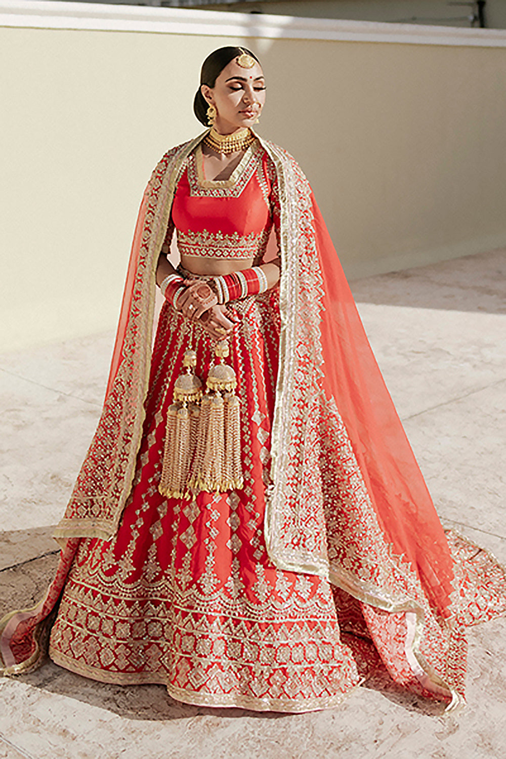 Bride: Sukhi Lidher Sidhu wearing our Red Nooraniyat Lehenga Set