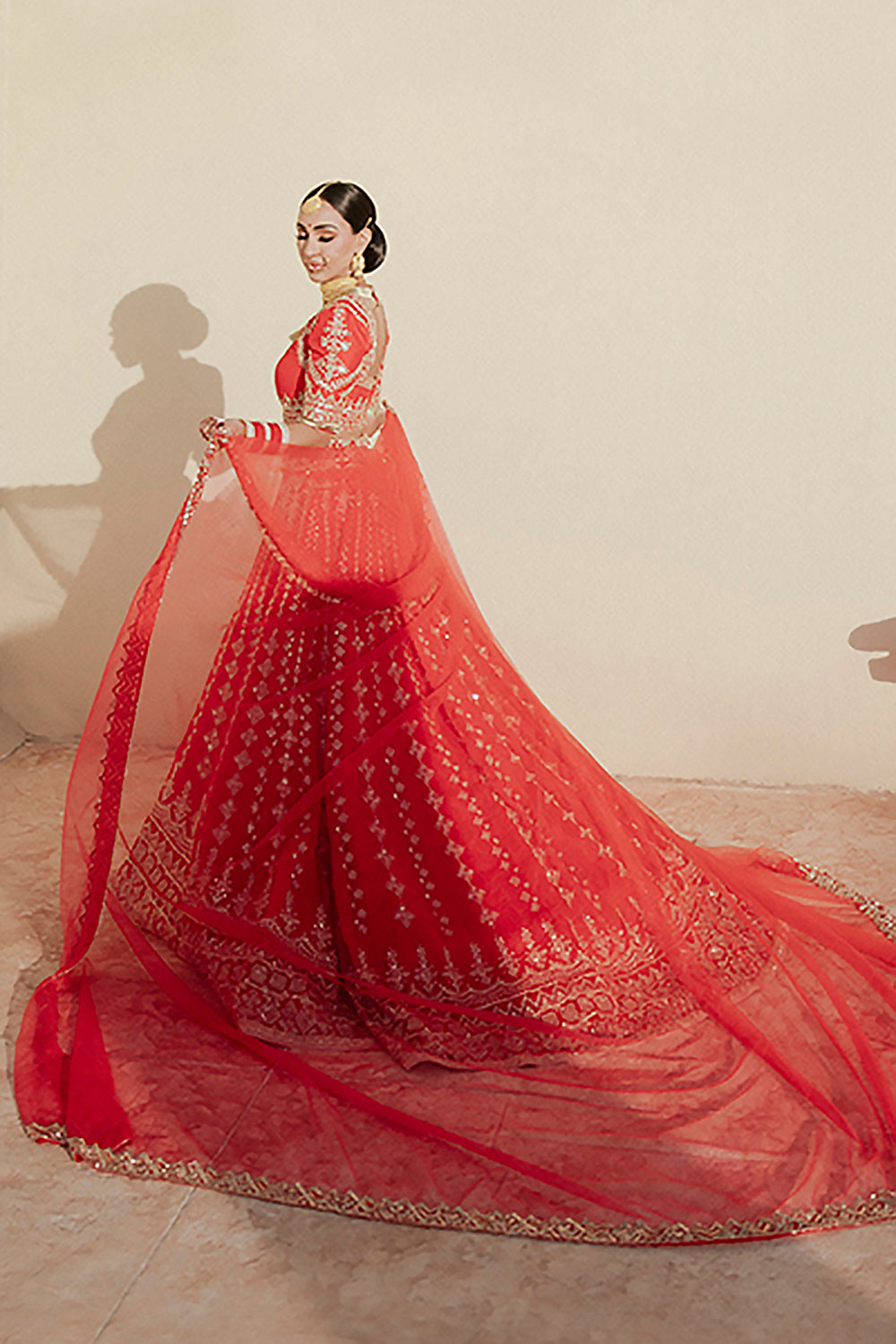 Bride: Sukhi Lidher Sidhu wearing our Red Nooraniyat Lehenga Set