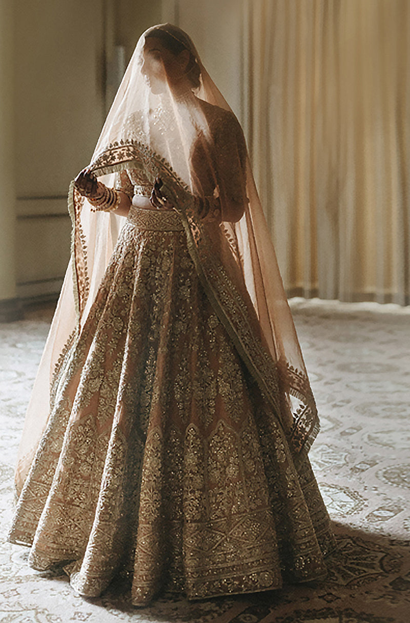 Bride: Ramneek Sodhi in Peach Gold Embroidered Lehenga Set
