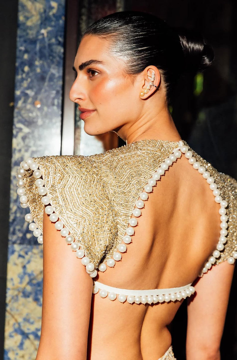 Saffron in our Ivory & Gold Fish-Cut Lehenga Set