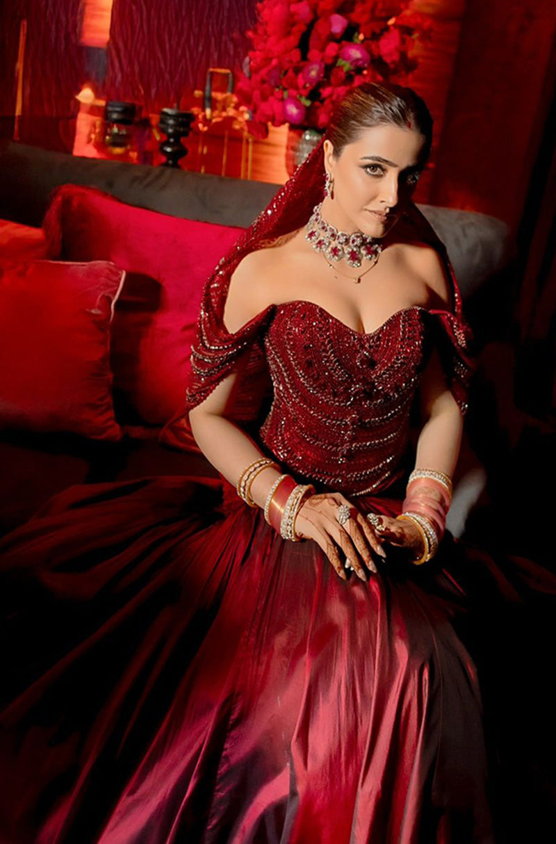 Bride: Nupur Sanon in our Red Bespoke Ensemble
