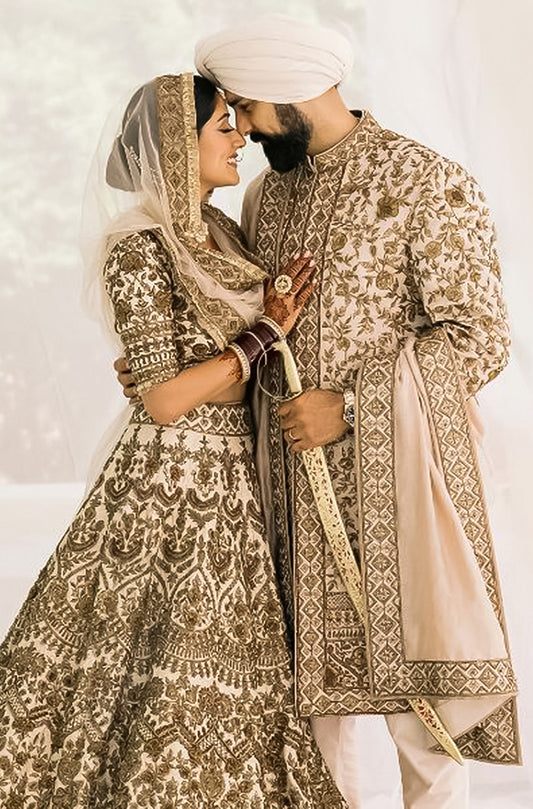Bride: Suneet Mann & Groom: Arsh Thind in our Ivory and Antique Gold Nooraniyat Emsemble
