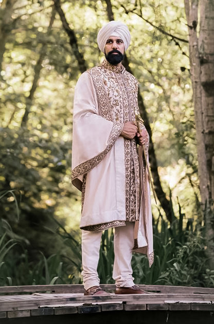 Bride: Suneet Mann & Groom: Arsh Thind in our Ivory and Antique Gold Nooraniyat Emsemble