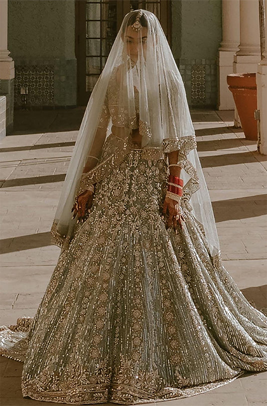 Bride: Sarika Patel in Moss Green Ruhaaniyat Lehenga Set
