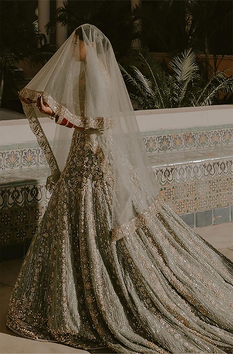 Bride: Sarika Patel in Moss Green Ruhaaniyat Lehenga Set