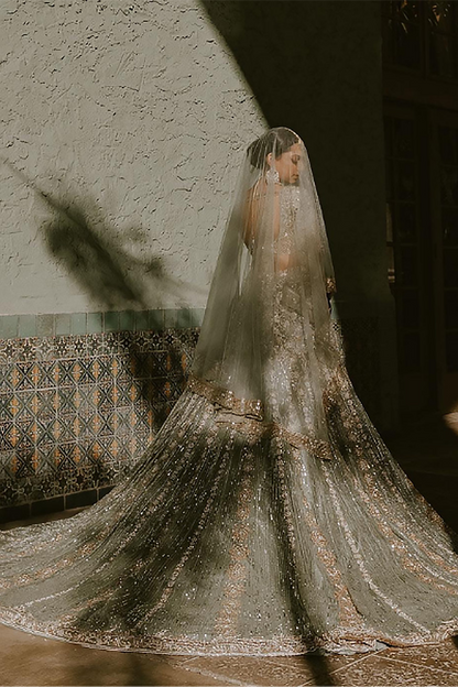 Bride: Sarika Patel in Moss Green Ruhaaniyat Lehenga Set