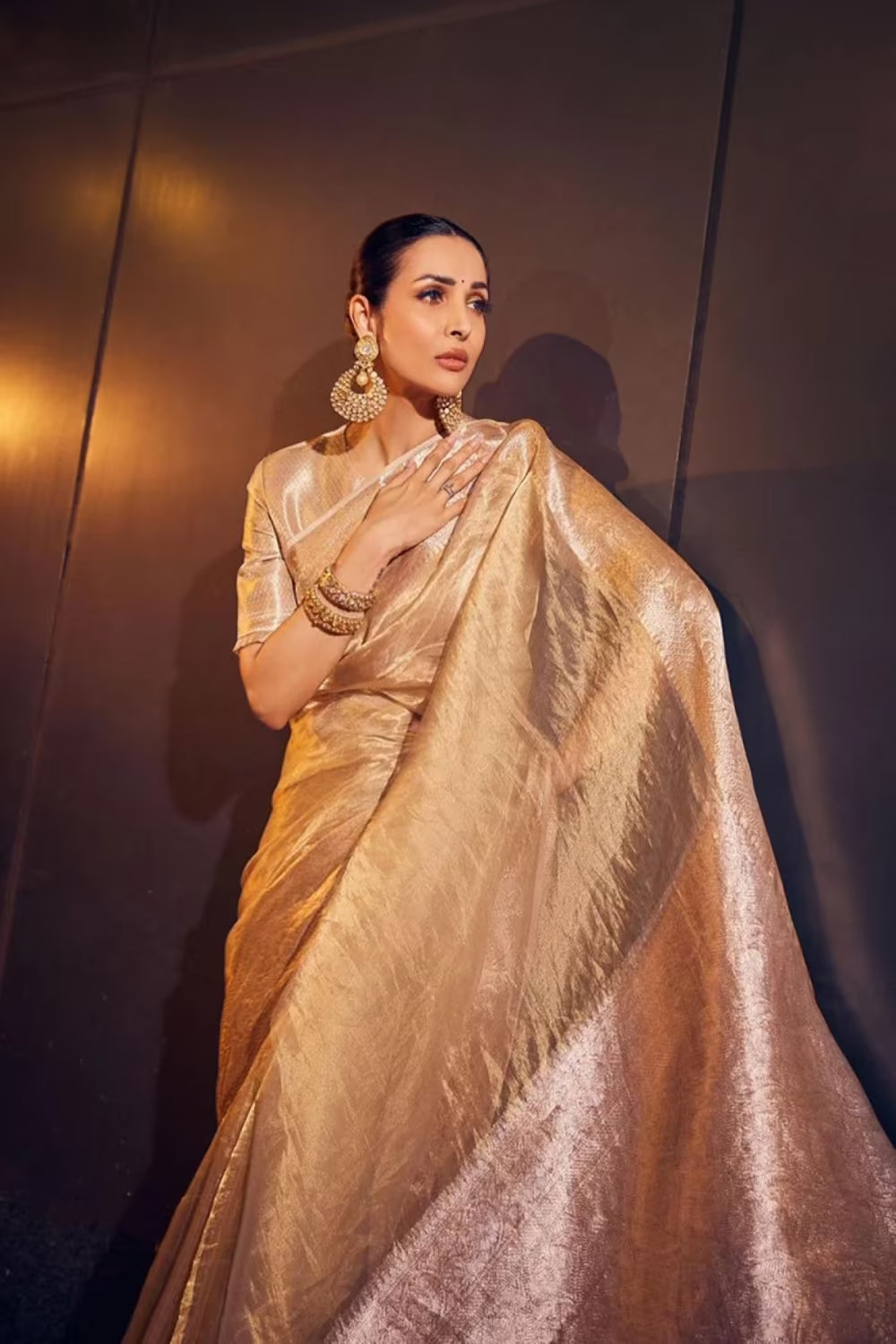 Malaika Arora in our Gold Woven Tissue Saree Set