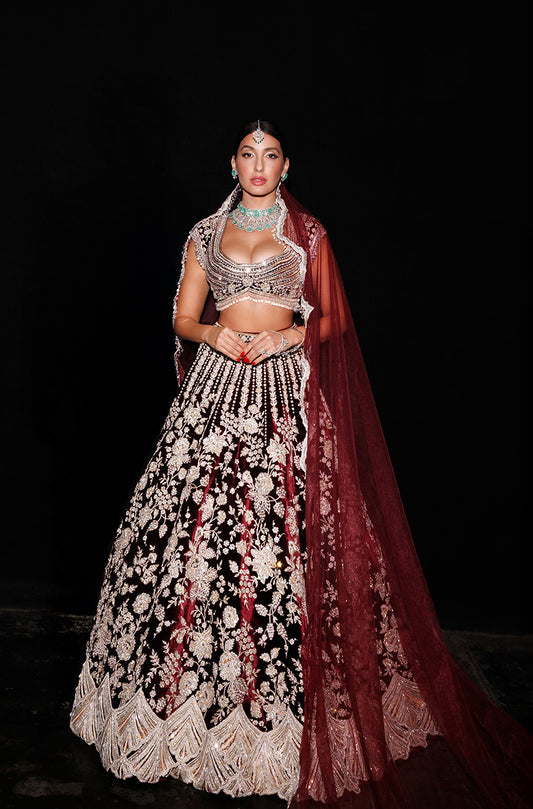 Nora Fatehi in our Garnet Red Velvet Embroidered Lehenga Set