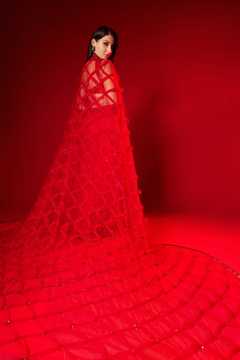 Nora Fatehi in our Red Saree and Cape Set