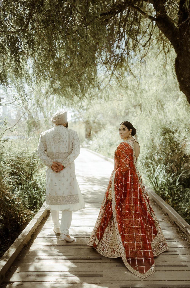 Bride: Raman Jawanda in our Scarlet Red Embroidered Lehenga Set