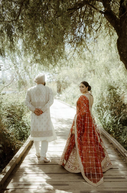 Bride: Raman Jawanda in our Scarlet Red Embroidered Lehenga Set