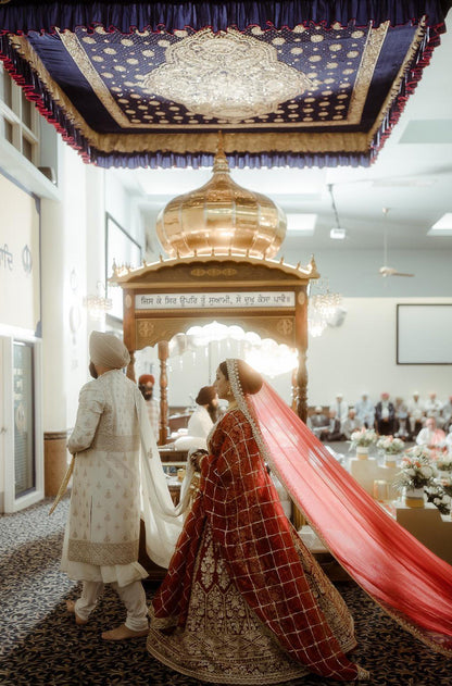 Bride: Raman Jawanda in our Scarlet Red Embroidered Lehenga Set