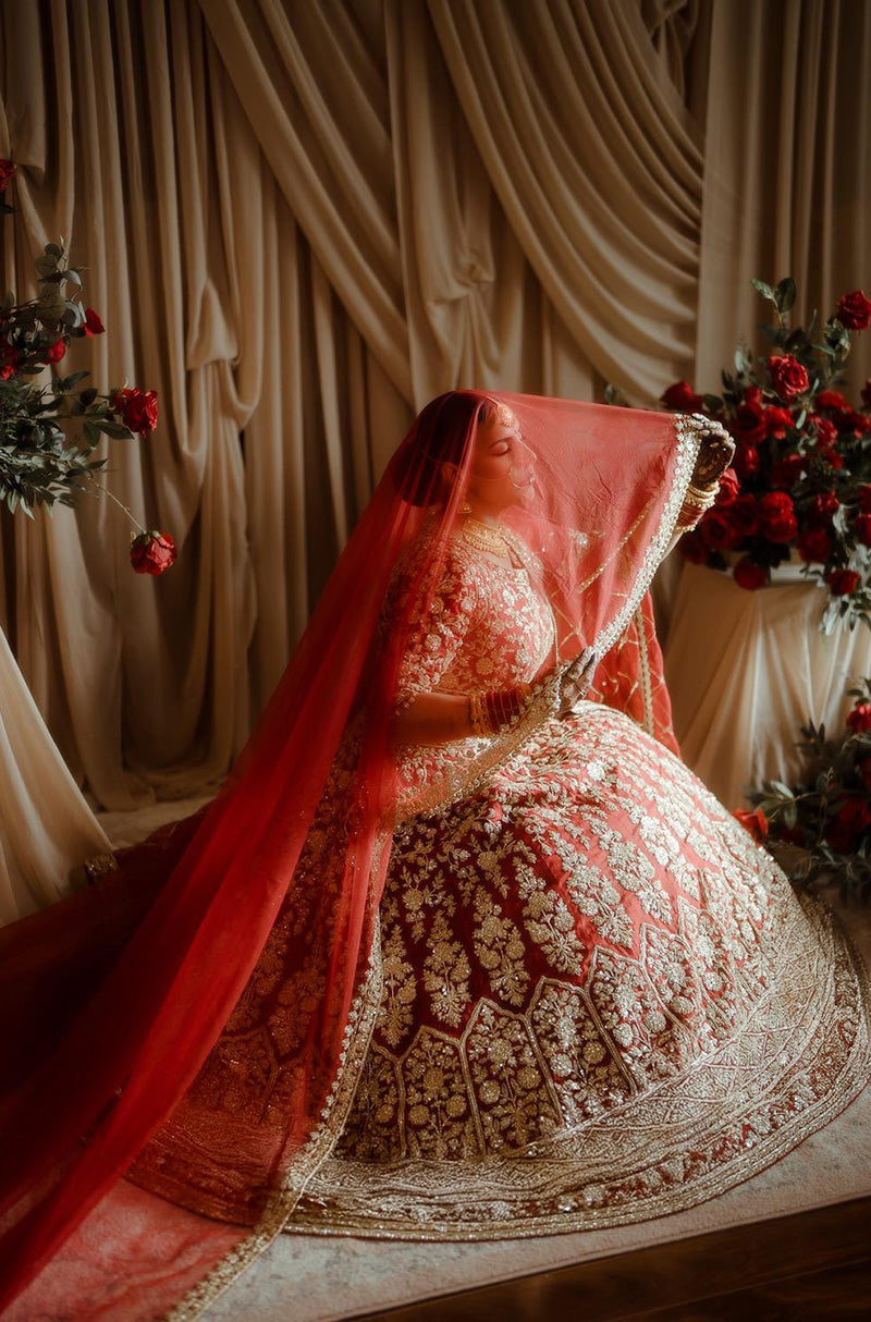 Bride: Raman Jawanda in our Scarlet Red Embroidered Lehenga Set