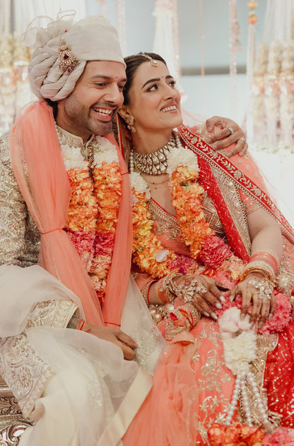 Bride: Nupur Sanon & Groom Stebin Ben in our Bespoke Ensemble