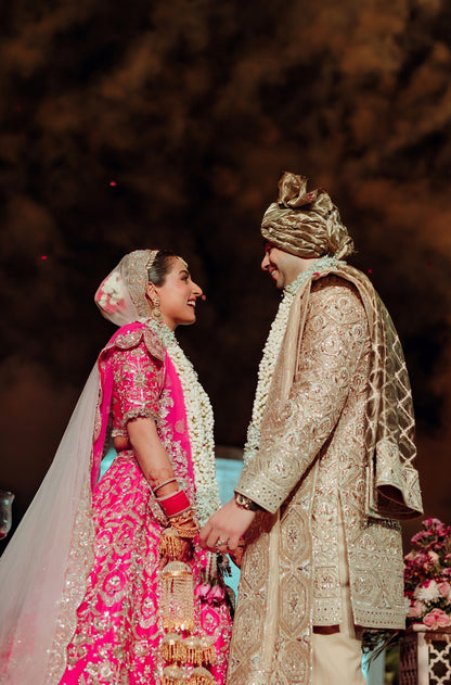 Bride: Gayatri Sarvaria & Groom Ranvir Sarvaria in our Wedding Ensemble