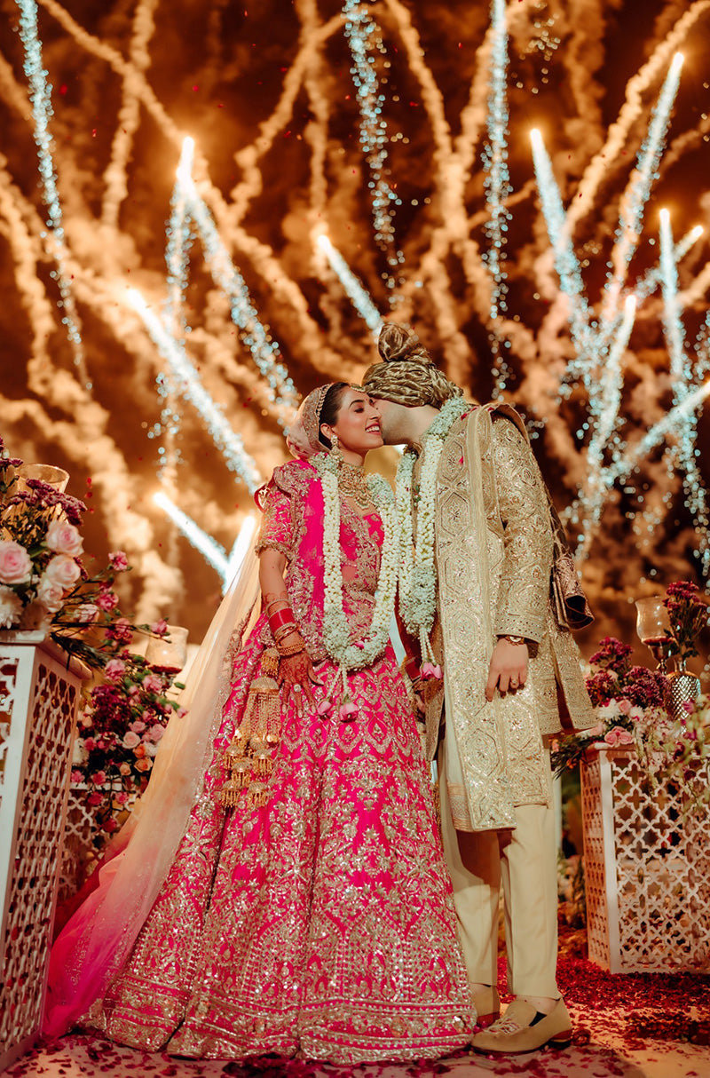 Bride: Gayatri Sarvaria & Groom Ranvir Sarvaria in our Wedding Ensemble