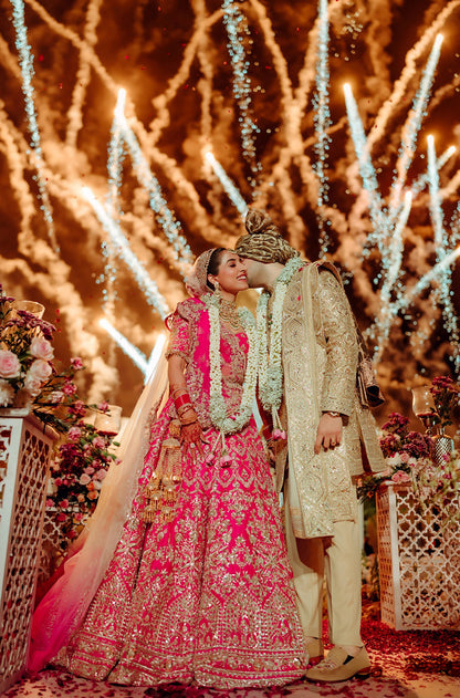 Bride: Gayatri Sarvaria & Groom Ranvir Sarvaria in our Wedding Ensemble