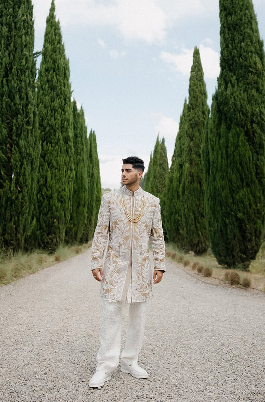 Groom: Mena Massoud in our Ivory & Beige Embroidered  Sherwani Set